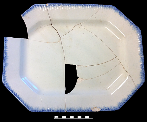 Edged refined white earthenware octagonal dish.  Impressed “13” on reverse.  Measurements:  14.5” x 11”, from 18BC27, Feature 30.